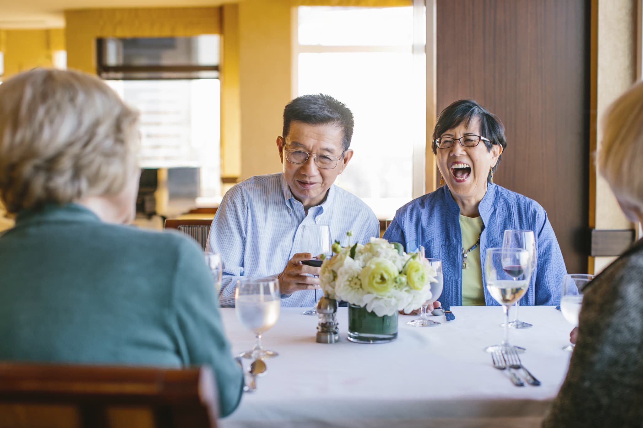 Couple dining and laughing.